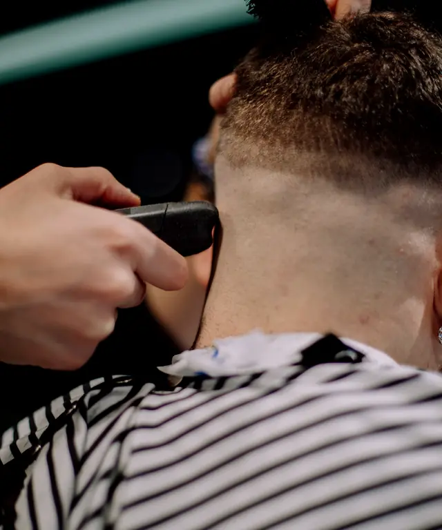 Sharp neckline on a client's short haircut