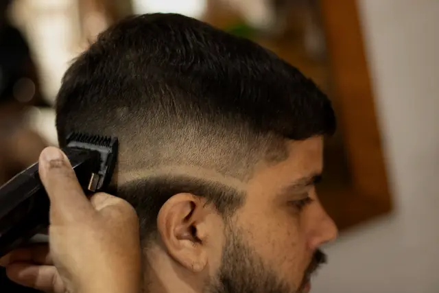 Side profile of a client during a haircut